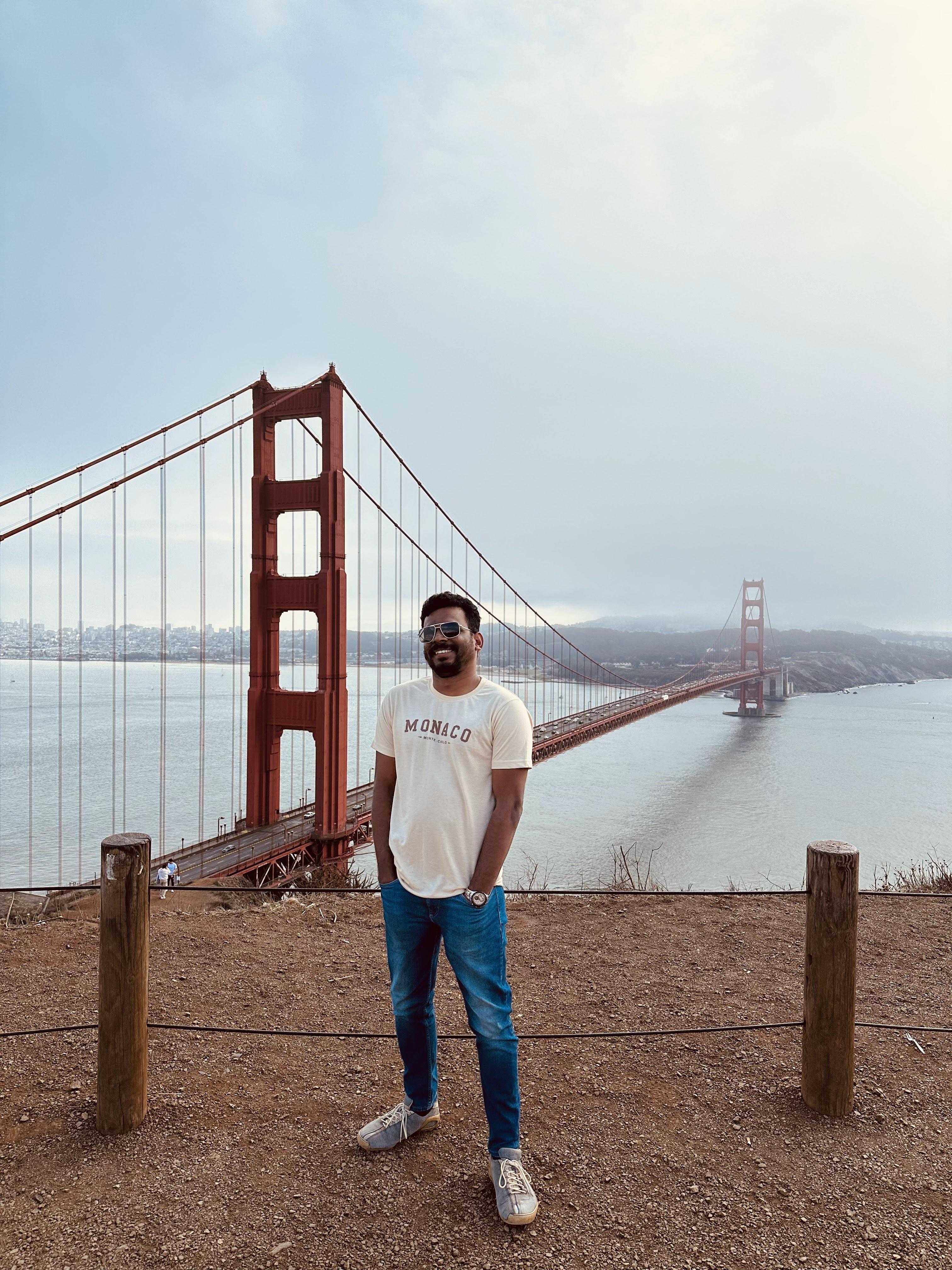 Vairav standing in front of the Golden Gate Bridge in San Francisco.